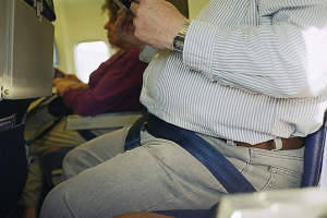 overweight traveler on airplane
